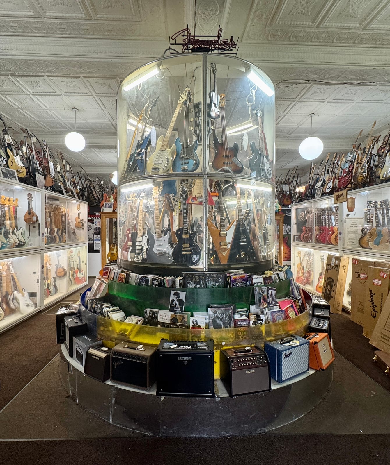 Entryway of the House of Guitars, guitars stacked floor to ceiling